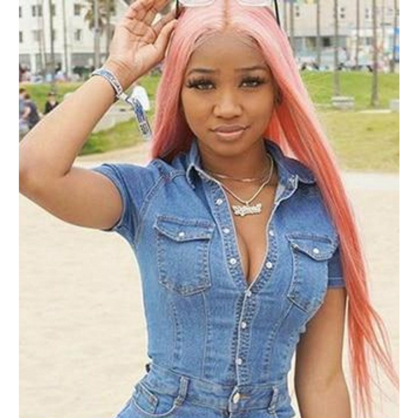 Woman with 30 inch long pink human hair wig